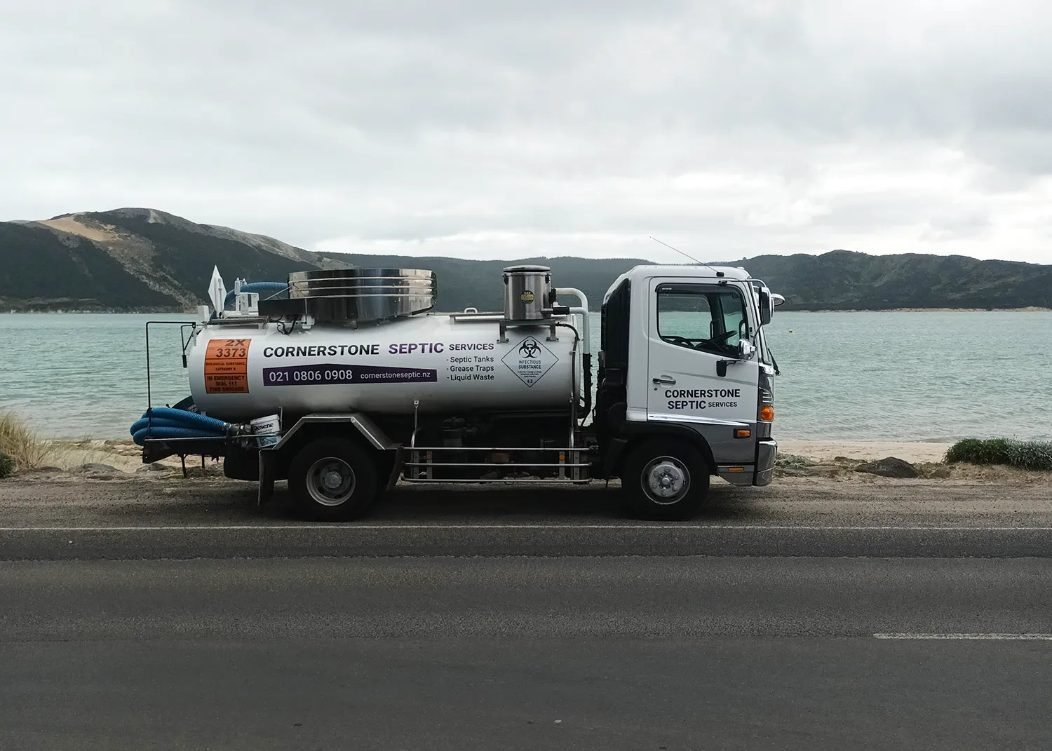 Cornerstone Septic Services truck parked in a coastal area of Northland